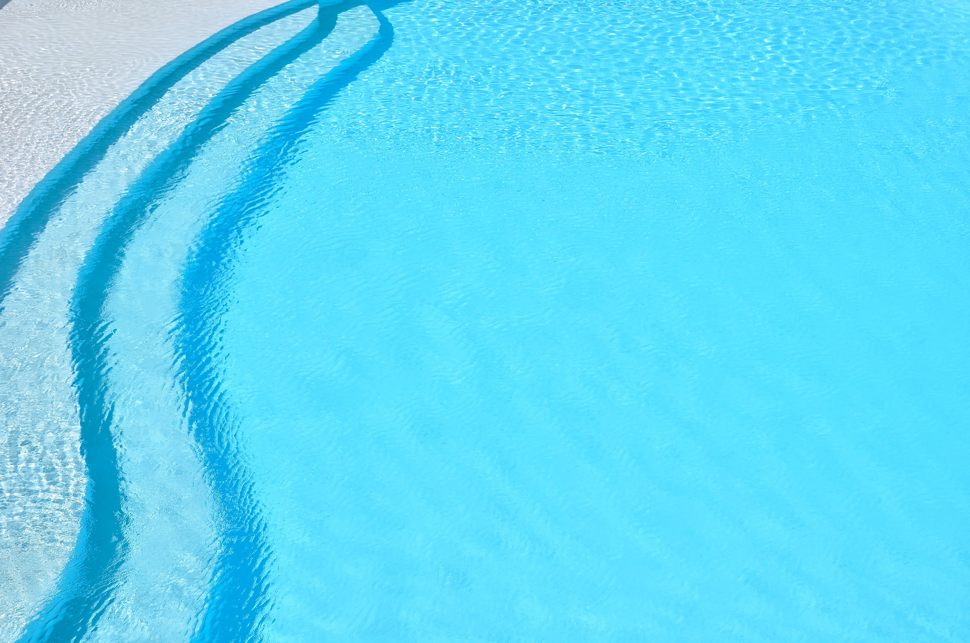 Blue swimming pool rippled water detail